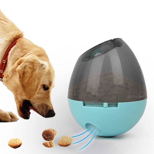 Orange and blue interactive pet food dispenser toy with multiple tiers and white balls, next to its black packaging. - Image 11
