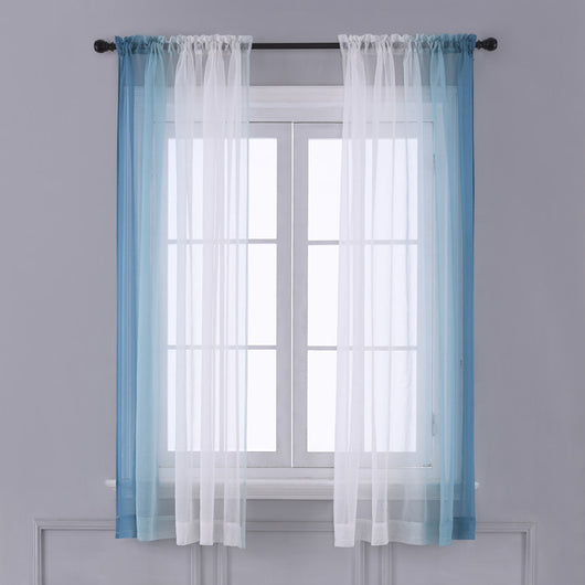 Pink and white gradient sheer rod pocket curtain panels hung on a black rod in front of a window.
