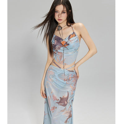 Light blue abstract print two-piece bikini set with a cropped halter top featuring chain straps and a ruched maxi skirt.