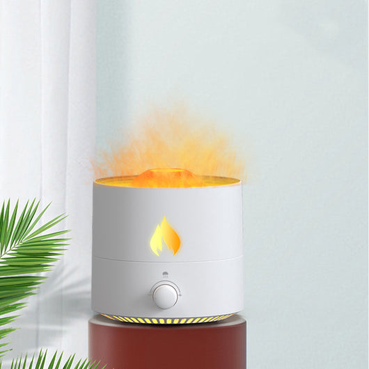 White cylindrical night light and ultrasonic humidifier with an orange flame effect light and a control knob. - Image 4