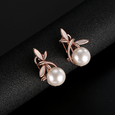 Rose gold-toned necklace and matching earrings set with white pearls and a delicate floral or leaf design. - Image 8