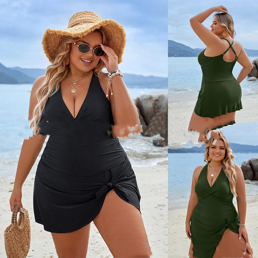 Plus size woman wearing a black one-piece skirted swimsuit with a halter neckline and side tie knot detail. - Image 10