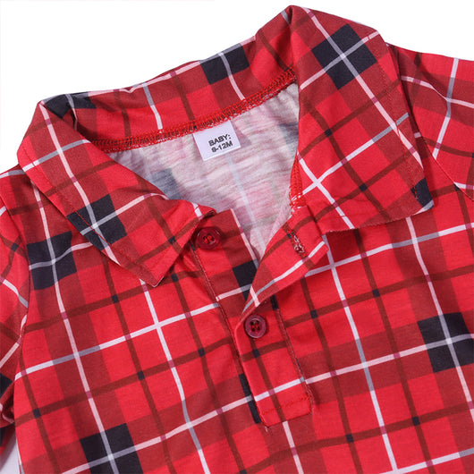 Family of four and their dog wearing matching red and black plaid Christmas pajamas, smiling against a white background. - Image 6