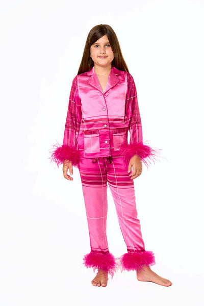 Young girl in a leopard print pajama set with black feather trim on the cuffs and ankles, wearing a pink glitter headband. - Image 10