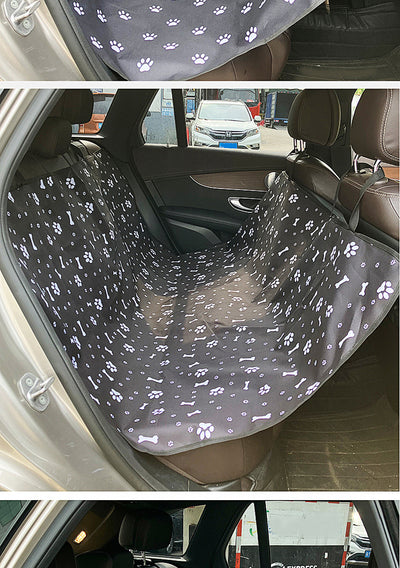 Pink car pet mat with white paw print and bone patterns, featuring black straps for securing to a rear seat. - Image 37