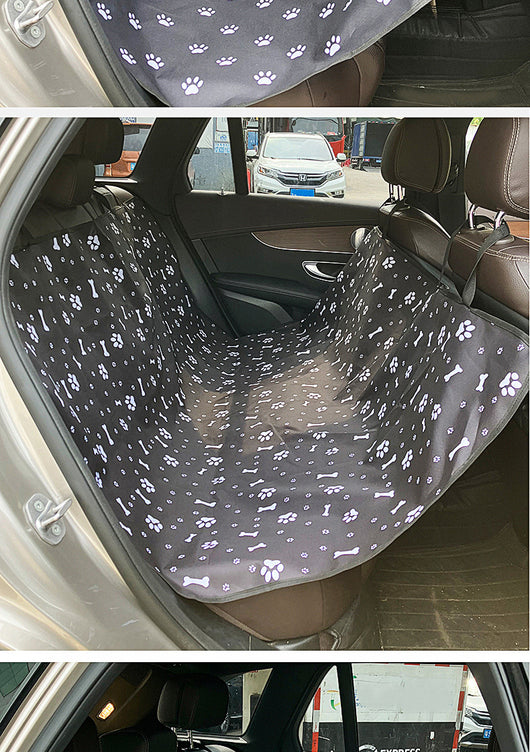 Pink car pet mat with white paw print and bone patterns, featuring black straps for securing to a rear seat. - Image 37