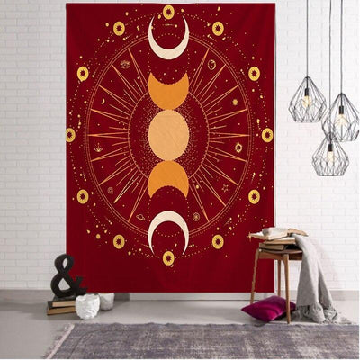 Red tapestry with a gold and cream triple moon, sunburst, and star celestial design.