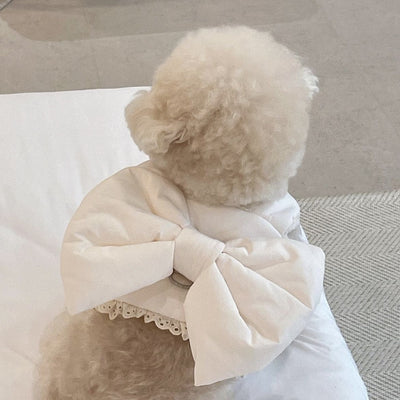 Creamy-white plush dog harness with a large decorative bow on the back, worn by a small poodle-like dog. - Image 19