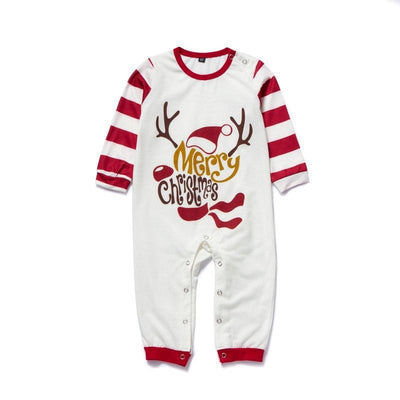 Matching navy blue family Christmas pajamas with white Christmas tree and "Merry Christmas" text, paired with patterned bottoms. - Image 4
