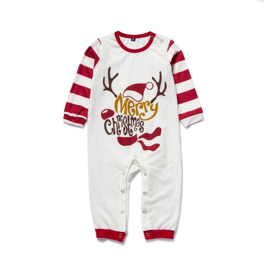 Matching navy blue family Christmas pajamas with white Christmas tree and "Merry Christmas" text, paired with patterned bottoms. - Image 4