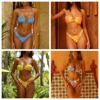 Women's pink and yellow floral print strapless bikini with an O-ring detail, modeled against a wooden door. - Image 2