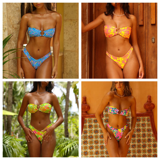 Women's pink and yellow floral print strapless bikini with an O-ring detail, modeled against a wooden door. - Image 2
