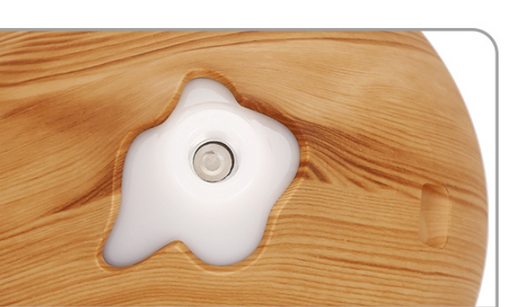 Teardrop-shaped aromatherapy humidifier with light wood grain finish, emitting mist and glowing with purple LED light. - Image 7