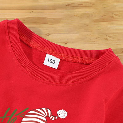 Family matching white long-sleeve crew neck tops with a cute snowman face print, featuring black eyes, an orange carrot nose, and a dotted smile. One adult top - Image 23