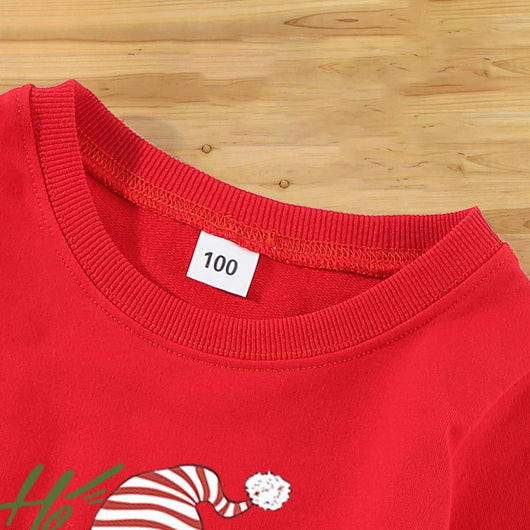 Family matching white long-sleeve crew neck tops with a cute snowman face print, featuring black eyes, an orange carrot nose, and a dotted smile. One adult top - Image 23