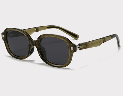 Brown oval sunglasses with dark lenses and thick frames, featuring visible silver hinges on a light gray background. - Image 6