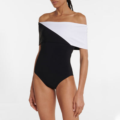 Black one-piece swimsuit with a deep V-neckline and white horizontal stitching detail across the plunge. - Image 27