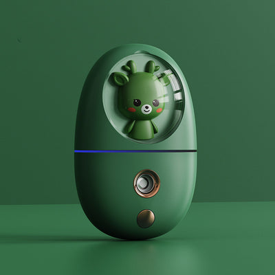 White egg-shaped portable facial humidifier with a pink cartoon rabbit inside a clear dome, gold nozzle and button. - Image 13