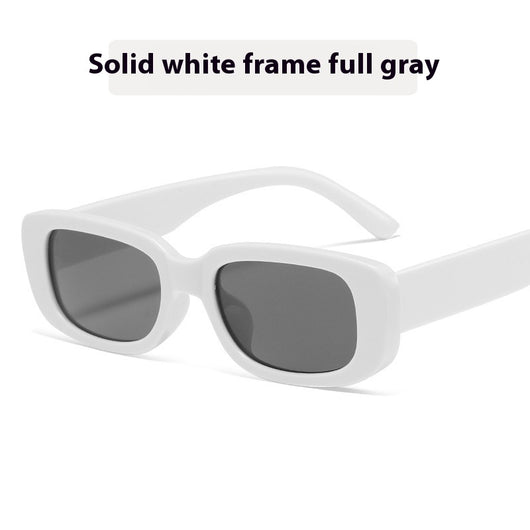 Children's small frame oval sunglasses with a solid white PC frame and brown AC lenses for UV protection. - Image 12