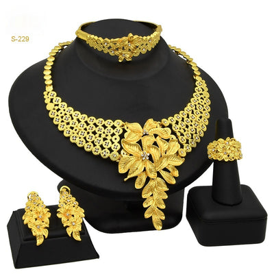 Women's Saudi bridal four-piece gold-colored jewelry set with floral and leaf designs, featuring a necklace, bracelet, earrings, and ring. - Image 7