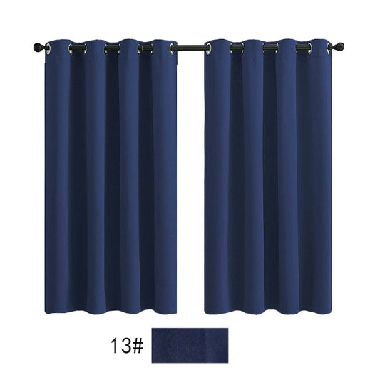 Pair of navy blue outdoor waterproof curtains with silver grommets on a black rod, against a white background.