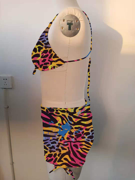 Plus-sized bikini swimsuit with vibrant multi-colored animal print, pleating, and drawstring details. - Image 16