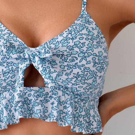 Women's blue and white floral print two-piece set with ruffled crop top and matching mini skirt. - Image 4