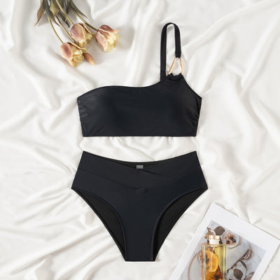 Black one-shoulder bikini with a gold-tone metal buckle detail and high-waisted bottoms with a V-front design. - Image 14