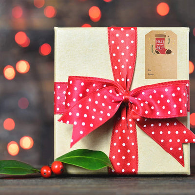 Kraft paper Christmas holiday gift sticker roll with various designs including reindeer, Christmas trees, and Merry Christmas text. - Image 13