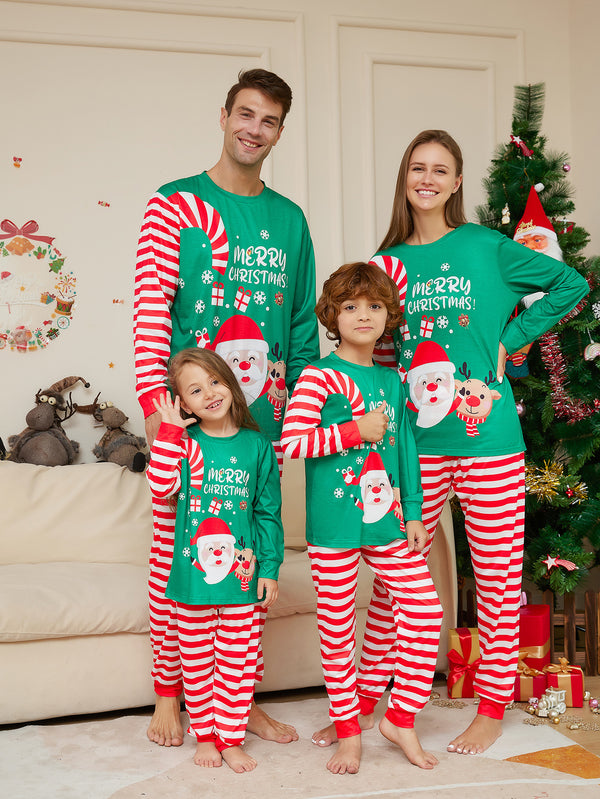 Family of four wearing matching green Christmas pajamas with Santa, reindeer, and red striped pants. - Image 7