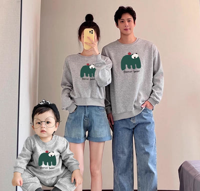 Matching cream crew neck sweatshirts, one adult and one child size, with a dark green bear graphic and "Boner bear" text. - Image 14