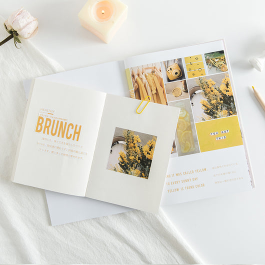White RosyPosy magazine sticker with a minimalist interior design print featuring a table, chair, and plants. - Image 6