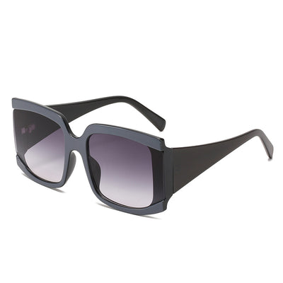 Oversized square-frame sunglasses with a light pink frame and gradient lenses transitioning from purple to orange to yellow. - Image 3