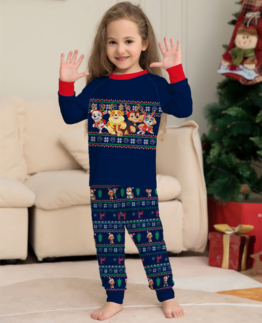 Woman in red Paw Patrol Christmas pajama top and navy fair isle bottoms with Santa Pups and reindeer. - Image 5