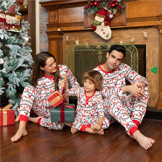 White baby romper with red and black Fair Isle pattern, Santa Claus, and Christmas trees, long sleeves, round neck.