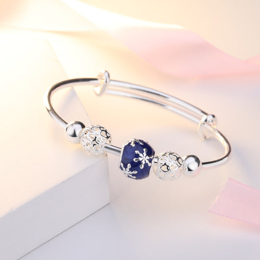 Pulsera Giratoria de Cobre con Cisne y Cuentas Plateadas