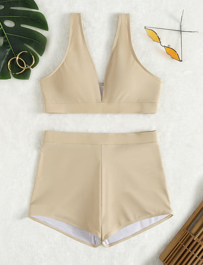 Women's deep-V Halong Bay-style two-piece swimsuit in light beige, featuring a crop top and high-waisted shorts. - Image 11