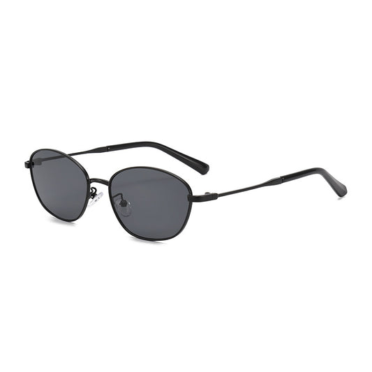 Small oval metal sunglasses for women with a gold frame and brown gradient lenses, featuring black temple tips. - Image 2