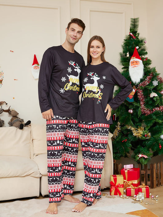 Two children wearing black long-sleeve Christmas pajamas with a "Merry Christmas" reindeer design and fair isle pants. - Image 8