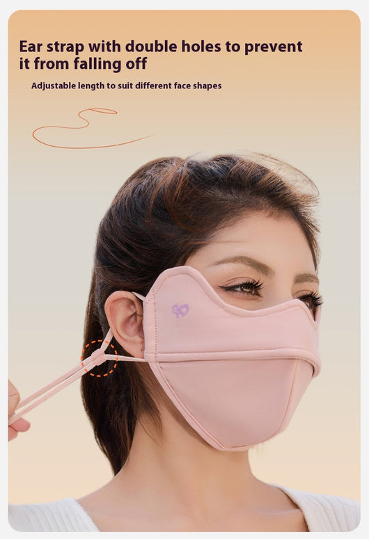 Woman wearing a grey outdoor cycling wind mask with ear hooks and a small heart logo, designed for cold-proof eye protection. - Image 17