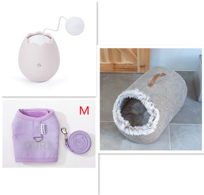 White egg-shaped automatic cat toy with a yellow interior and a flexible wire holding a yellow fuzzy ball. - Image 11