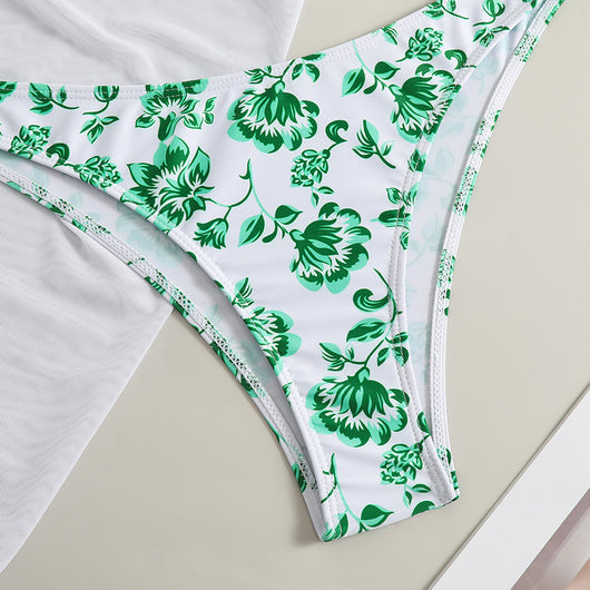 White and yellow floral print three-piece bikini set with a halter triangle top, high-cut bottom, and sheer white sarong. - Image 19