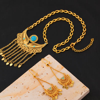 Gold-toned necklace and dangle earrings set with filigree water droplet design, turquoise accents, and tassel charms. - Image 6