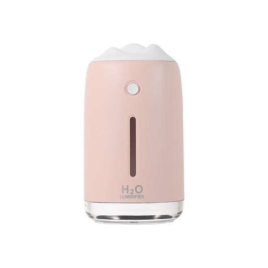 Dark night green mini humidifier with a white mountain-shaped top, clear base, and visible water level indicator. - Image 2
