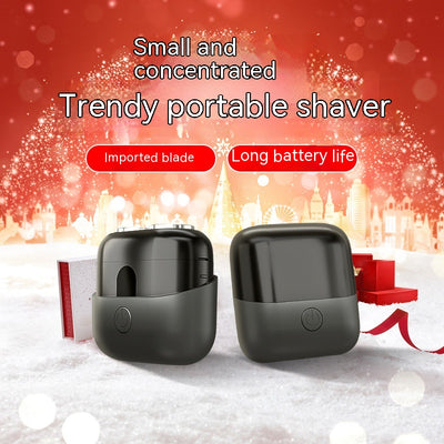 Silver mini electric shaver with a double-headed rotary design and a black power button on top. - Image 10
