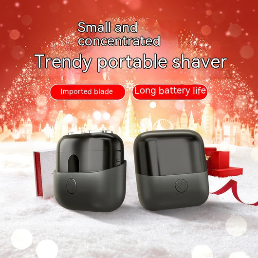 Silver mini electric shaver with a double-headed rotary design and a black power button on top. - Image 10