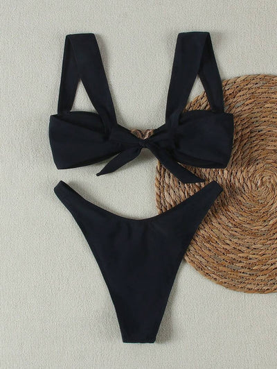 Bright yellow bikini with wide shoulder straps and a gold metal decoration on the top, worn by a woman. - Image 25
