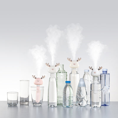 White and clear columnar mini humidifier with a cute bird-shaped top, featuring rose gold beak and tail accents. - Image 5