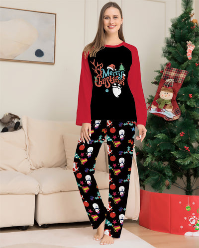 Man wearing a black and red long-sleeve Christmas pajama set with "Merry Christmas" graphic and Santa print pants. - Image 4
