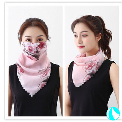 White women's UV protection scarf with black speckle pattern, worn as a face mask and neck scarf. - Image 3